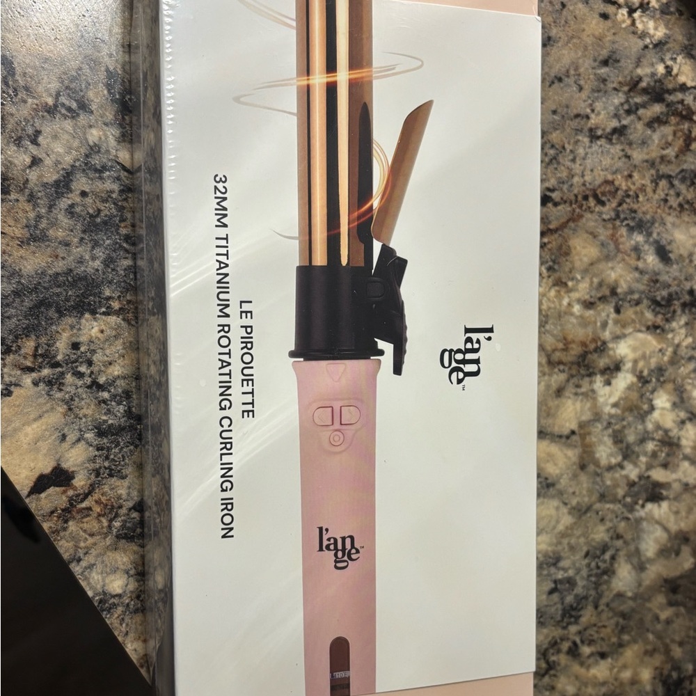 Brand new never out of package L’ange hair curling iron Rotating